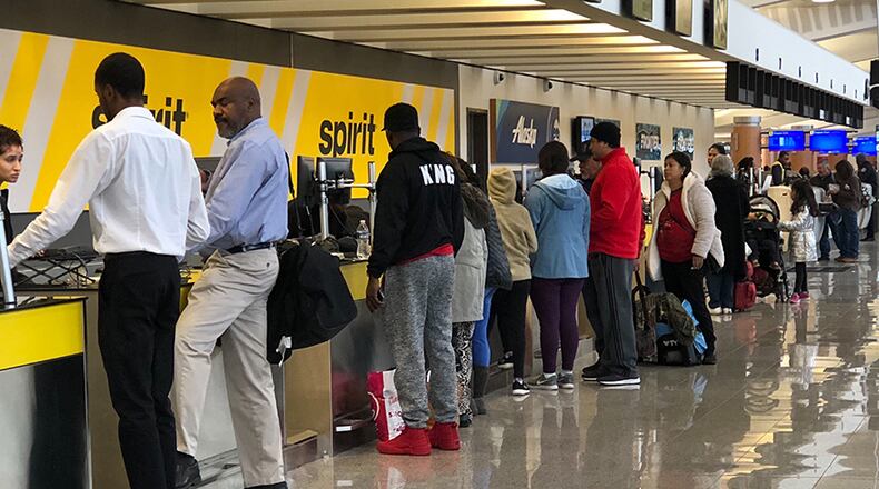 Flights at Hartsfield-Jackson International Airport were held Saturday morning after a threatening note was discovered on a plane, authorities said. Operations were returning to normal after 9 a.m. (Photo: Chris Joyner/AJC)