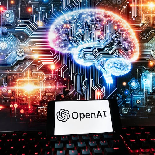 FILE - The OpenAI logo is displayed on a cell phone with an image on a computer monitor generated by ChatGPT's Dall-E text-to-image model, Friday, Dec. 8, 2023, in Boston. (AP Photo/Michael Dwyer, File)