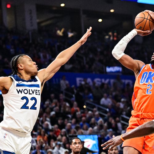 Oklahoma City Thunder guard Shai Gilgeous-Alexander (2) shoots against Minnesota Timberwolves guard Jaylen Clark (22) during the first half of an Emirates NBA Cup basketball game, Wednesday, Nov. 26, 2025, in Oklahoma City. (AP Photo/Gerald Leong)
