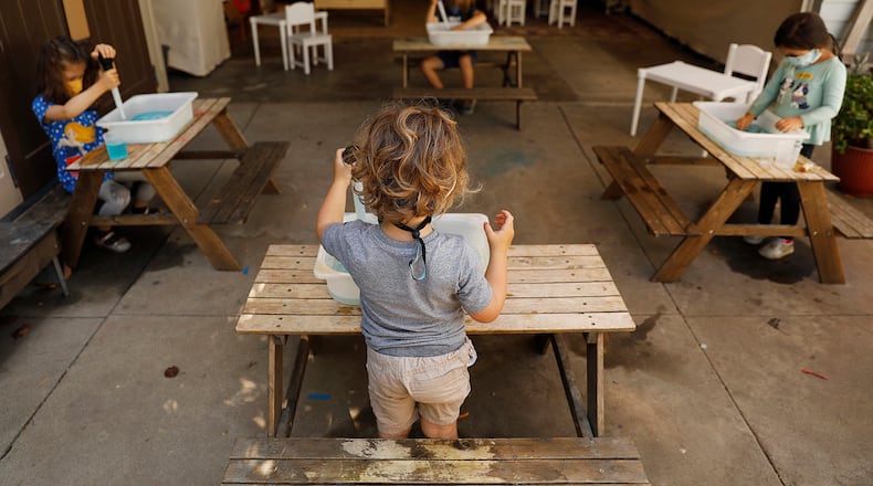 Children do activities at separate tables at Voyages Preschool in Los Angeles, Calif. on Thursday, August 27, 2020. Christina House/Los Angeles Times/TNS