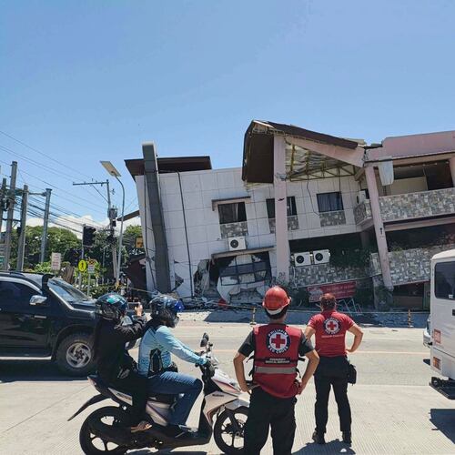 In this photo provided by the Philippine Red Cross, rescuers inspect the damage after an earthquake in General Santos, Philippines, Monday, June 8, 2026. (Philippine Red Cross via AP)