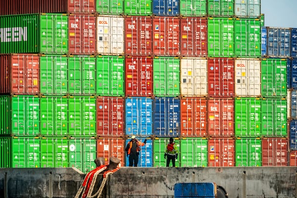 FILE - Dockworkers secure lines from a container ship at the Port of Oakland on April 4, 2025, in Oakland, Calif. (AP Photo/Noah Berger, File)