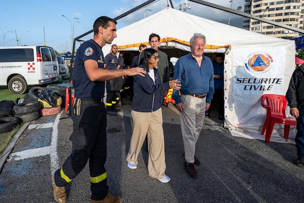 Lieutenant-Colonel Vianney Labbe, left, head of the detachment of the French 7th Civil Security Training and Intervention Regiment (RIISC 7), Venezuela's interim President Delcy Rodriguez, center, Oliver Blanco, Venezuela's Vice Minister for Europe and North America, and French ambassador to Venezuela Emmanuel Pineda, right, visit a temporary camp of the French Civil Security in La Guaira, Wednesday,  July 1, 2026, following the June 24 earthquakes. (Miguel Medina/Pool Photo via AP)