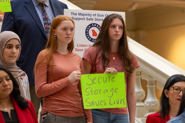 Audrey Lyons and Julia Barton, juniors at Midtown High School, show their support for House Bill 1, a gun safety measure, at the Capitol in Atlanta on Friday.