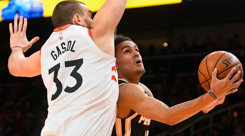 Hawks 6-1 Trae Young takes on Toronto's 7-1 Marc Gasol Monday. (AP Photo/John Amis)