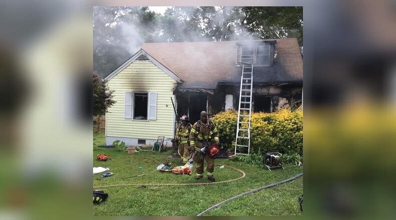 DeKalb County firefighters battle a blaze Sunday on Medlock Road.