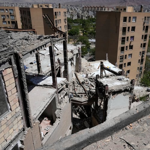 Damage is visible on a residential building that, according to Iranian authorities, was hit by a strike on March 4 during the U.S.-Israeli military campaign, in southeastern Tehran, Iran, Tuesday, April 14, 2026. (AP Photo/Vahid Salemi)