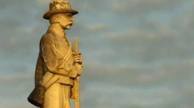 Confederate flags at this memorial were vandalized recently in Statesboro. (Credit: Statesboro Herald)