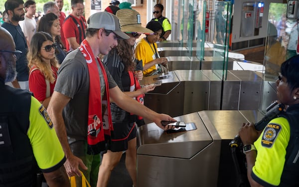 Soccer fans tap to enter the Vine City MARTA station after the South Africa verses Czechia match on Thursday, June 18, 2026. (Ben Hendren for the AJC)