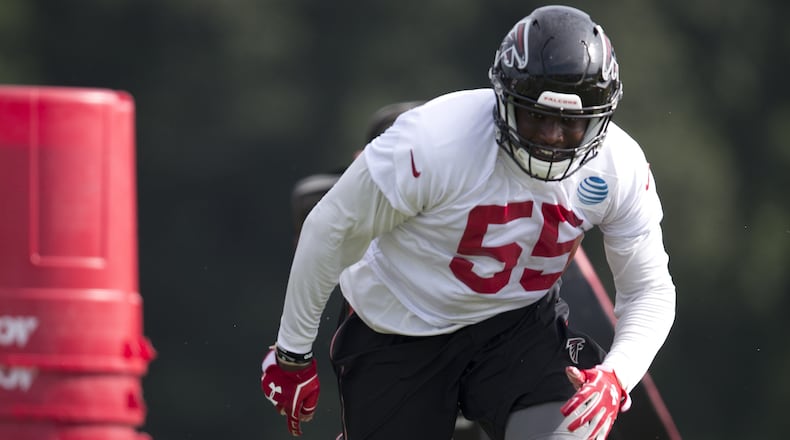 Atlanta Falcons defensive end J.T. Jones (55) runs drill during the team's NFL training camp football practice Friday, July 28, 2017, in Flowery Branch, Ga. (AP Photo/John Bazemore)