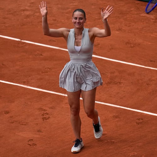 Ukraine's Marta Kostyuk reacts after the fourth-round tennis against Poland's Iga Swiatek match at the French Open in Paris, Sunday, May 31, 2026. (AP Photo/Christophe Ena)
