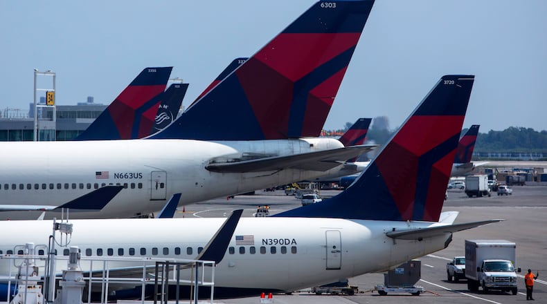 NEW YORK - JULY 22: Delta Air Lines planes sit at Terminal 4 at John F. Kennedy Airport July 22, 2014 in New York City. The Federal Aviation Administration (FAA) has halted all flights from the U.S. to Tel Aviv, Israel following a rocket attack near Ben Gurion International Airport. (Photo by Eric Thayer/Getty Images)