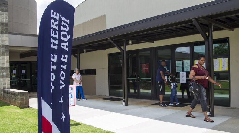 Gwinnett County residents take part in the primary election voting at Bogan Community Center in Buford, Georgia, on Tuesday, May 22, 2018. (REANN HUBER/REANN.HUBER@AJC.COM)