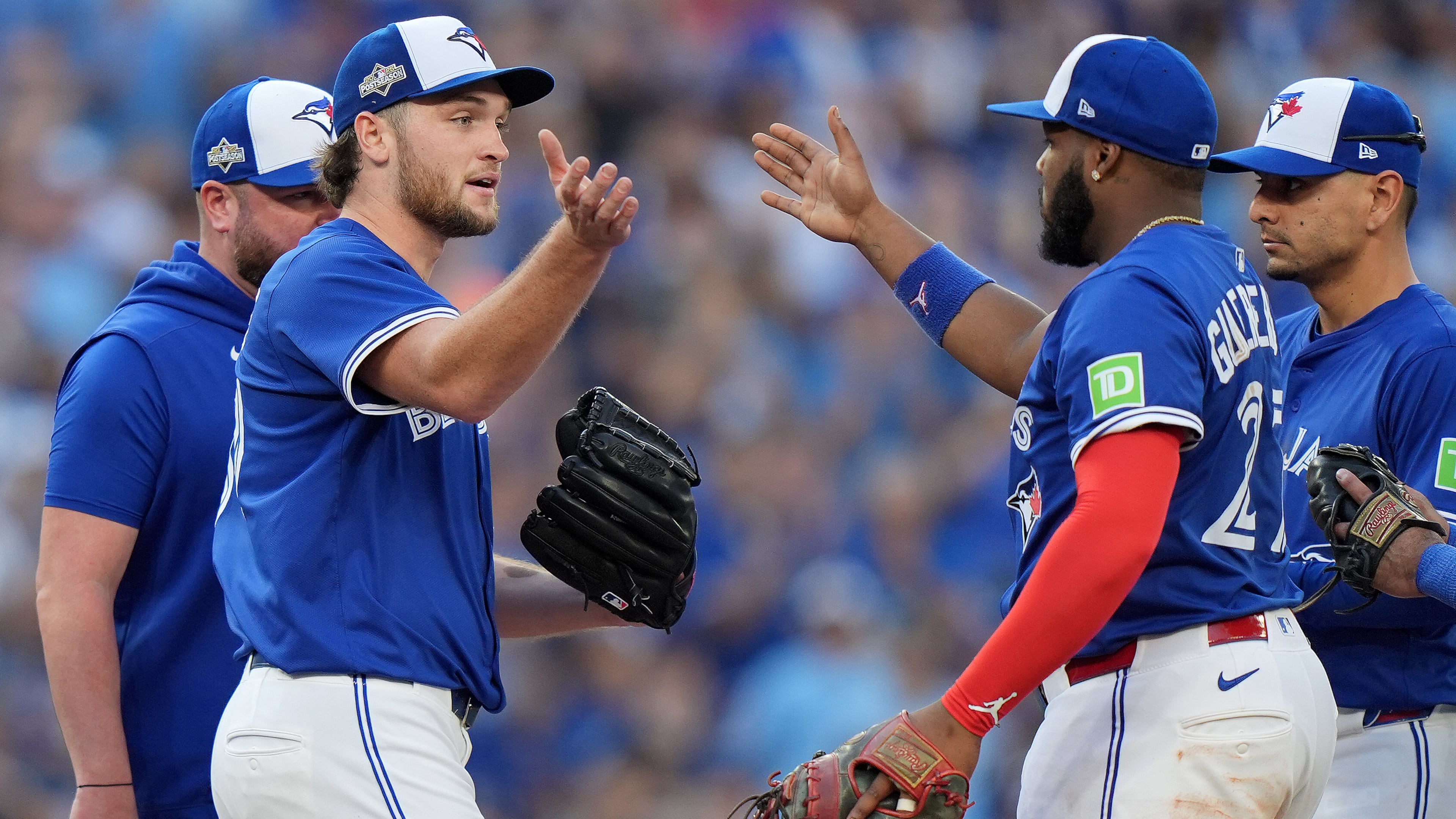 Toronto Blue Jays pitcher Trey Yesavage, front left, celebrates with teammate Vladimir Guerrero Jr., front right, after being pulled from the mound by manager John Schneider, back left, during the sixth inning of Game 2 of baseball's American League Division Series against the New York Yankees in Toronto, Sunday, Oct. 5, 2025. (Frank Gunn/The Canadian Press via AP)