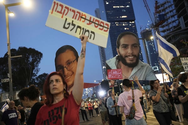 People take part in a protest demanding the end of the war and immediate release of hostages held by Hamas in the Gaza Strip, and against Prime Minister Benjamin Netanyahu's government in Tel Aviv, Israel, Saturday, June 7, 2025. (AP Photo/Ohad Zwigenberg)