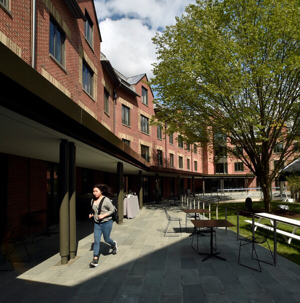 FILE - A student runs through the courtyard of Baker Hall at Yale Law School in New Haven, Conn., Sept. 20, 2018. (Peter Hvizdak/New Haven Register via AP, file)