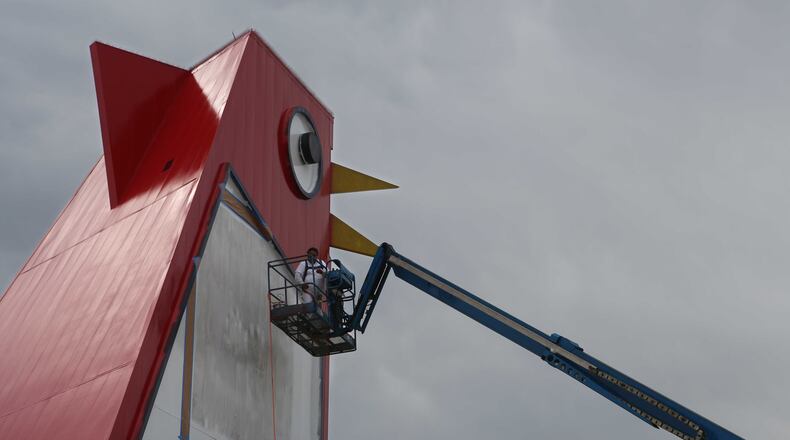 Marlon Ramirez paints  the Big Chicken in Marietta, Georgia, on Wednesday. It's undergoing its first real renovation in years.