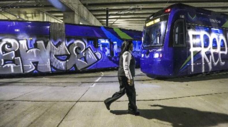 Two of the streetcars vandalized overnight Monday. (JOHN SPINK /JSPINK@AJC.COM)