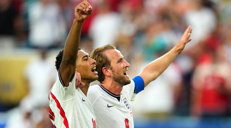 Jude Bellingham, left, and Harry Kane celebrates England's victory over Norway in a World Cup quarterfinal soccer match in Miami Gardens, Fla., Saturday, July 11, 2026. (AP Photo/Julio Cortez)