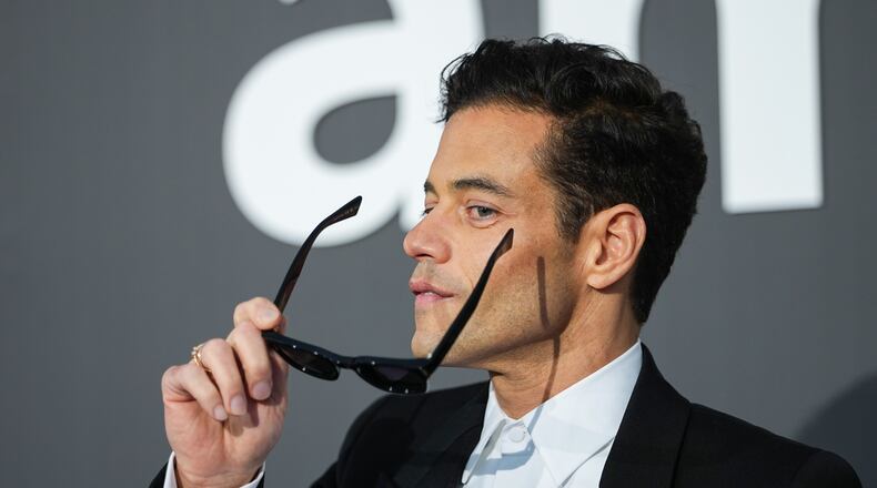 Rami Malek poses for photographers upon arrival at the amfAR Cinema Against AIDS benefit at the Hotel du Cap-Eden-Roc, during the 79th Cannes international film festival, Cap d'Antibes, southern France, Thursday, May 21, 2026. (Photo by Scott A Garfitt/Invision/AP)A