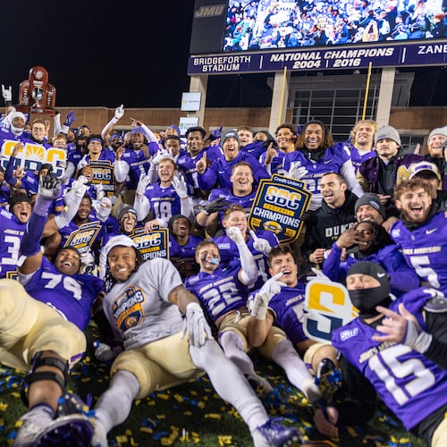 James Madison team celebrates after winning the Sun Belt championship NCAA college football game against Troy, Friday, Dec. 5, 2025, in Harrisonburg, Va. (AP Photo/Robert Simmons)