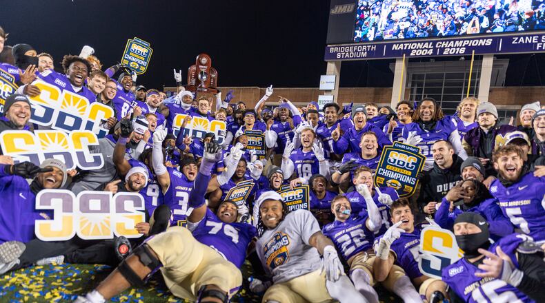 James Madison team celebrates after winning the Sun Belt championship NCAA college football game against Troy, Friday, Dec. 5, 2025, in Harrisonburg, Va. (AP Photo/Robert Simmons)