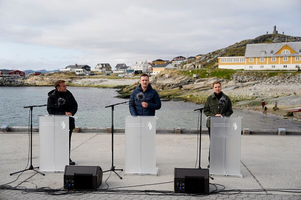 French President Emmanuel Macron, left, Denmark's Prime Minister Mette Frederiksen, right, and the Greenlandic leader Jens-Frederik Nielsen hold a press conference in Nuuk, Greenland, Sunday, June 15, 2025. (Mads Claus Rasmussen/Ritzau Scanpix via AP)