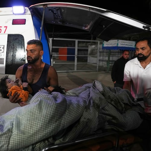 Palestinians injured in an Israeli army strike are brought to Al-Aqsa Hospital in Deir al-Balah, Gaza Strip, Wednesday, Oct. 29, 2025. (AP Photo/Abdel Kareem Hana)