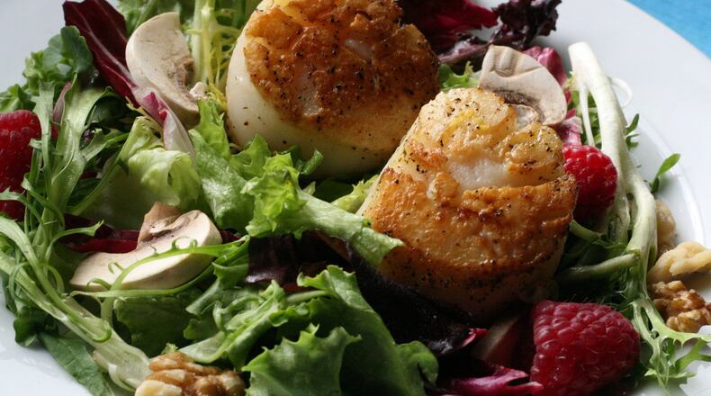Pan-seared Scallops with Fresh Greens and Raspberries, in a June 2008 file image. (Mary Schroeder/Detroit Free Press/TNS)