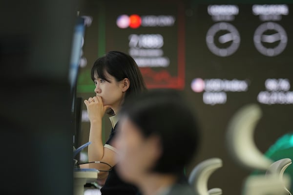 Dealers watch their computer monitors at a dealing room of Hana Bank in Seoul, South Korea, Wednesday, June 18, 2025. (AP Photo/Lee Jin-man)