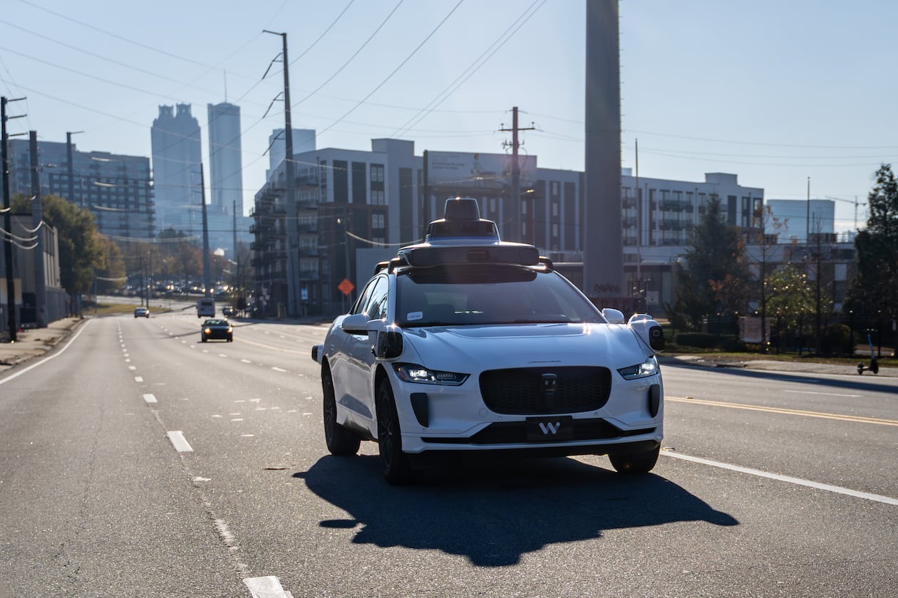 A Waymo self-driving taxi travels down Northside Drive in Atlanta. Waymo suspended services in several cities, including Atlanta, because of the severe weather. (Ben Hendren for the AJC 2025)