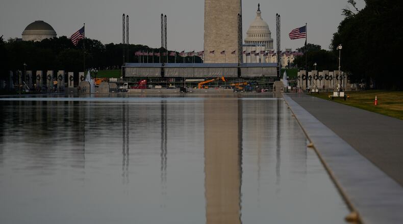 The U.S. Capitol and the Washington Monument are reflected in the Lincoln Memorial Reflecting Pool Thursday, June 25, 2026, in Washington. (AP Photo/Carolyn Kaster)
