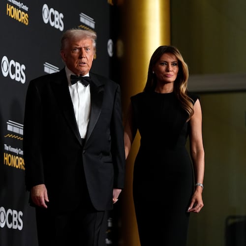 FILE - President Donald Trump and first lady Melania Trump, walk the red carpet before the 48th Kennedy Center Honors, Dec. 7, 2025, at the John F. Kennedy Center for the Performing Arts in Washington. (AP Photo/Julia Demaree Nikhinson, file)