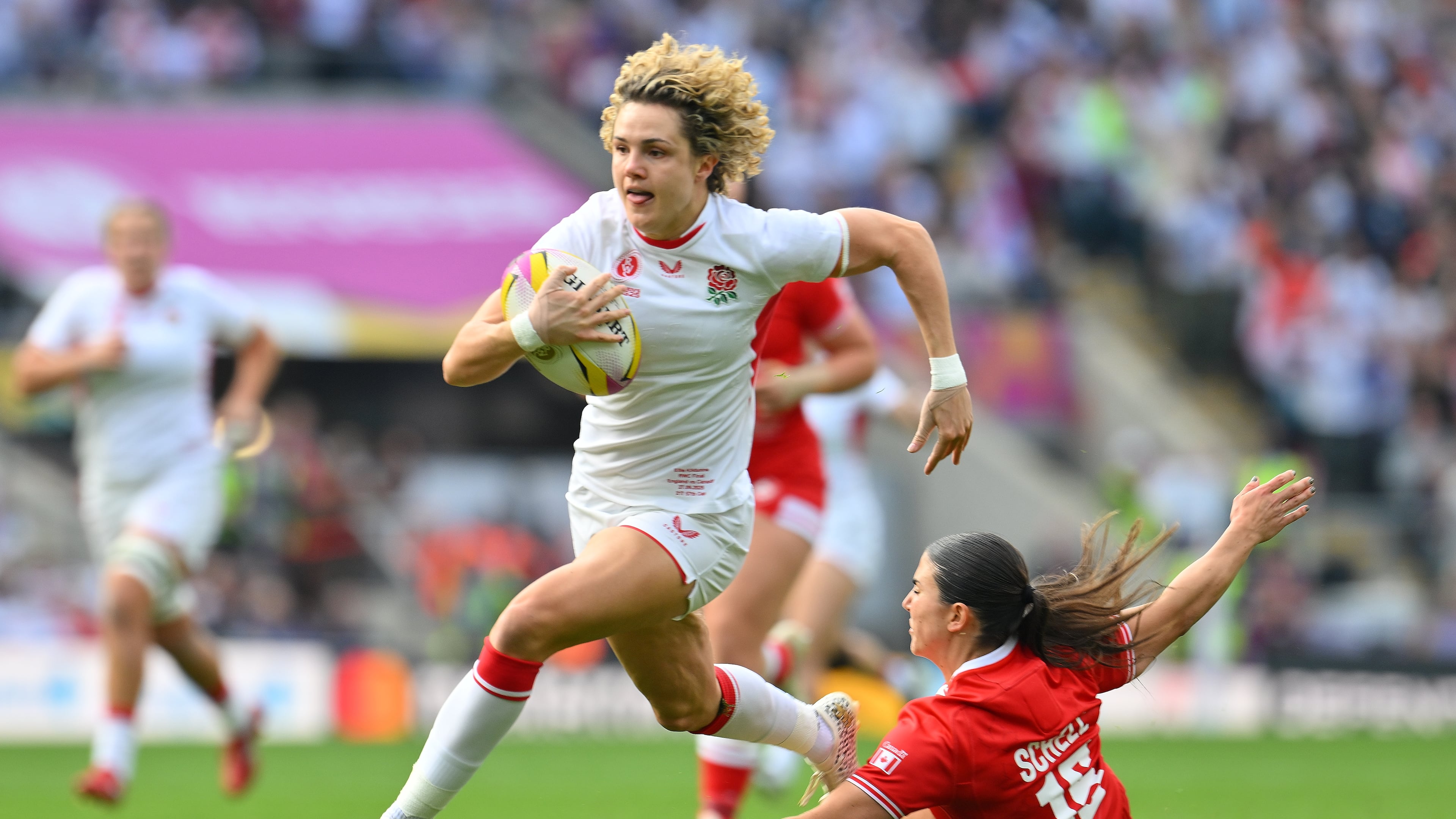 England's Ellie Kildunne runs to score a try during the Women's Rugby World Cup final match between England and Canada at the Allianz Stadium, Twickenham in London, Saturday, Sept. 27, 2025.(AP Photo/Anthony Upton)