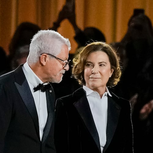 FILE - Armani Chairman Pantaleo Dell’Orco, left, and Giorgio Armani's niece Silvana Armani acknowledge the applause at the end of the Giorgio Armani Spring/Summer 2026 collection show in Milan, Italy, Sunday, Sept. 28, 2025. (AP Photo/Luca Bruno, File)