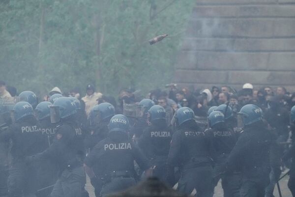 Lazio fans riot with police ahead of the Italian Serie A soccer match between Lazio and Roma at Rome's Olympic stadium, Sunday, April 13, 2025. (AP Photo/Gregorio Borgia)