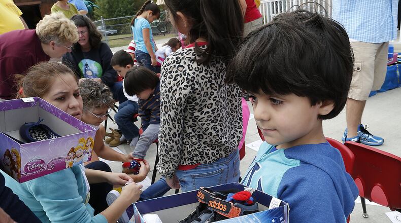 The Atlanta Hawks will giveaway shoes to 65 kids at the Decatur Family YMCA on Wednesday.