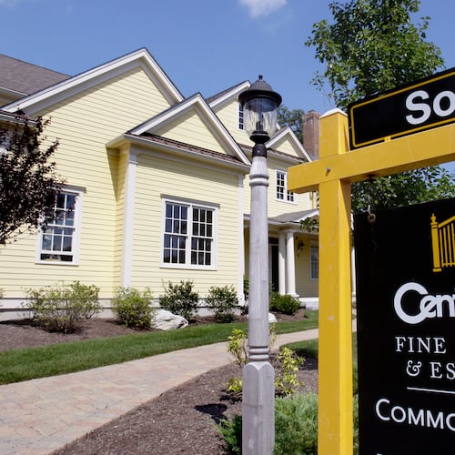 FILE - A sold sign is posted outside a newly constructed luxury home in Wellesley, Mass., Aug. 25, 2009. (AP Photo/Charles Krupa, File)
