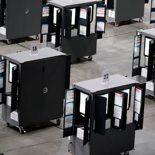 FILE - Voting machines fill the floor for early voting at State Farm Arena, Oct. 12, 2020, in Atlanta. (AP Photo/Brynn Anderson, File)