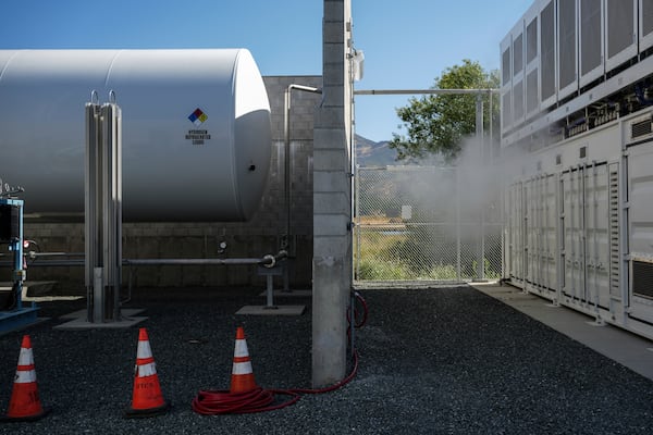 A tank that holds liquid hydrogen, left, which is converted to gas to run the fuel cells, sits at at Energy Vault, a company that is creating an emergency power system that relies on hydrogen and battery storage, on Tuesday, May 27, 2025, in Calistoga, Calif. (AP Photo/Annika Hammerschlag)