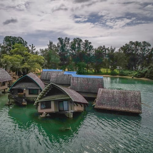 FILE - The once iconic Holiday Inn villas in Port Vila, Vanuatu, sit partially sunken, July 19, 2025, after being hit by multiple cyclones and an earthquake that caused irreparable damage. (AP Photo/Annika Hammerschlag, File