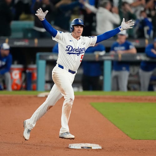 Los Angeles Dodgers' Freddie Freeman celebrates his walk off home run against the Toronto Blue Jays during the 18th inning in Game 3 of baseball's World Series, Monday, Oct. 27, 2025, in Los Angeles. (AP Photo/Mark J. Terrill)