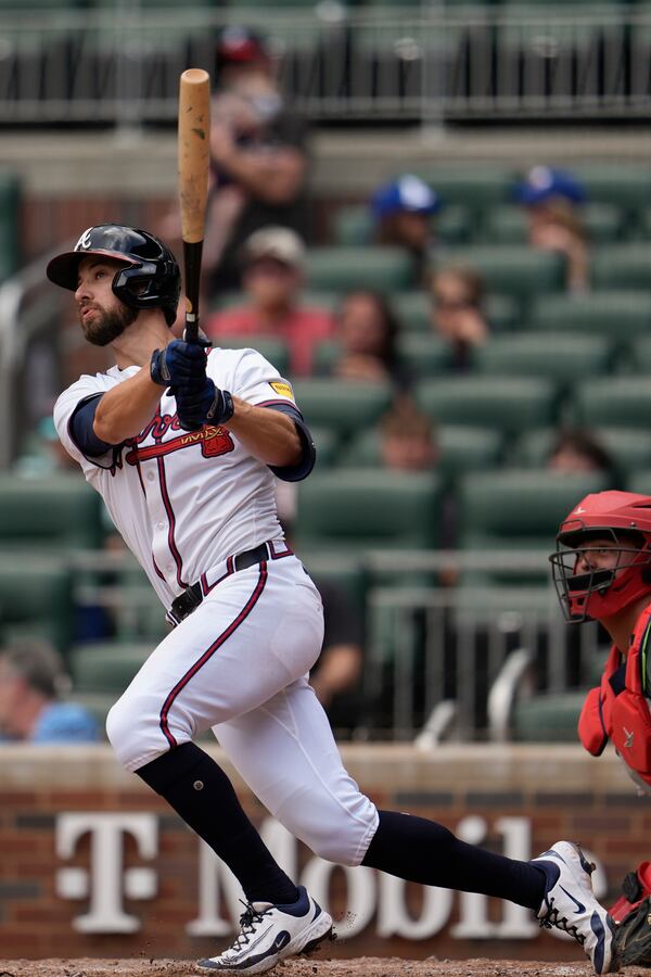 Atlanta Braves outfielder Eli White (36) hits a three-run homer against the St. Louis Cardinals in the eighth inning of a baseball game, Wednesday, April 23, 2025, in Atlanta. (AP Photo/Mike Stewart)