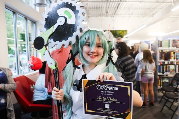 Ansley Parkins takes home the Best Youth award after the CosMania Runway Show at the Gwinnett County Public Library on Saturday, Aug. 9, 2025, in Duluth. (Abbey Cutrer/AJC)