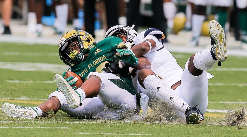 Georgia Tech Yellow Jackets defensive back Tariq Carpenter (2) tackles South Florida Bulls running back Johnny Ford (20). (Alyssa Pointer/alyssa.pointer@ajc.com)