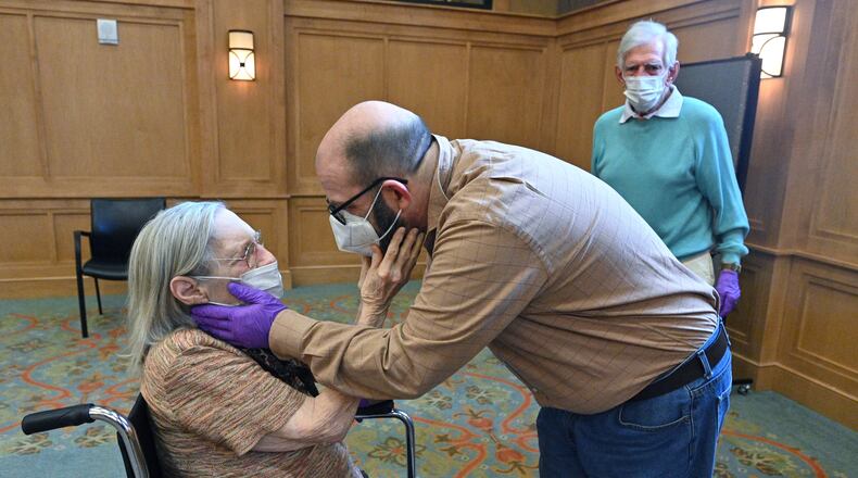 Connie Kendrick and her son William Kendrick embrace earlier this month during a visit at the William Breman Jewish Home in Atlanta. Nursing homes and other long-term care facilities have gradually reopened to visitors, allowing residents to reconnect with their loved ones after months of isolation. (Hyosub Shin / Hyosub.Shin@ajc.com)
