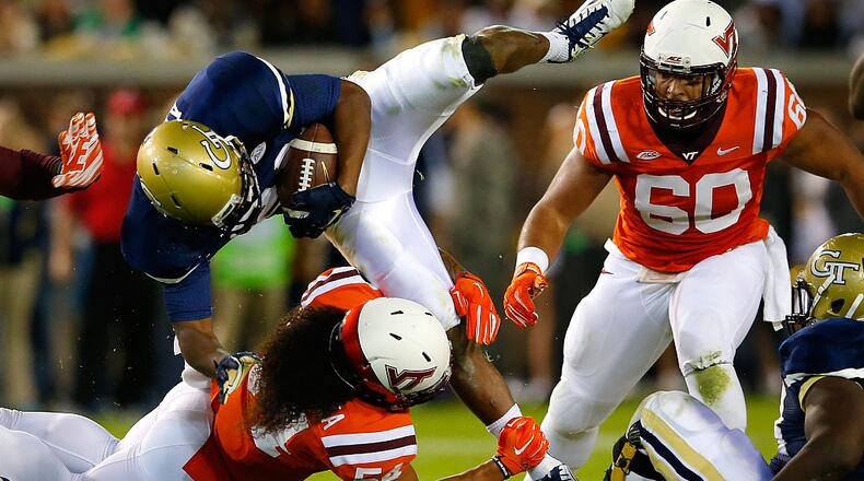 Andrew Motuapuaka #54 of the Virginia Tech Hokies tackles Marcus Allen #24 of the Georgia Tech Yellow Jackets at Bobby Dodd Stadium on November 12, 2015 in Atlanta, Georgia. (Photo by Kevin C. Cox/Getty Images)