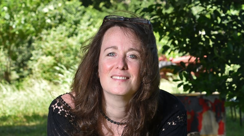 Children’s author Laurel Snyder, shown at Red’s Farm, has five children’s books that have or will come out in 2017. She has a contract and is currently working on the novel “My Jasper June” (working title only), which is set at Red’s Farm, a real urban farm in Ormewood Park, her East Atlanta neighborhood. HYOSUB SHIN / HSHIN@AJC.COM