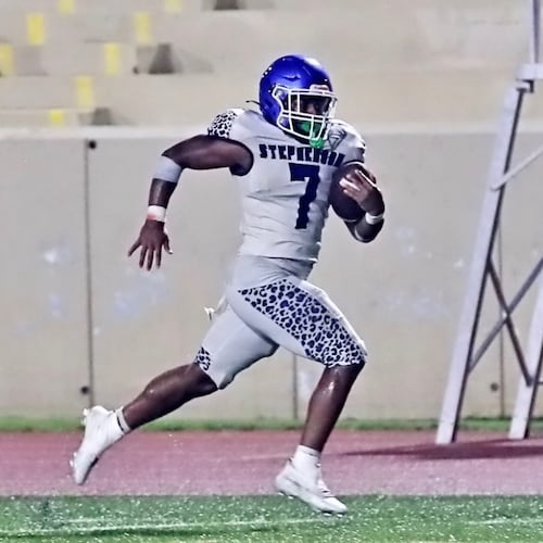 Stephenson High School running back Jayden Johnson rushes against Arabia Mountain in 2025. (Courtesy of DeKalb County School District Athletics)
