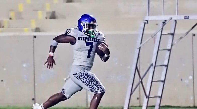 Stephenson High School running back Jayden Johnson rushes against Arabia Mountain in 2025. (Courtesy of DeKalb County School District Athletics)